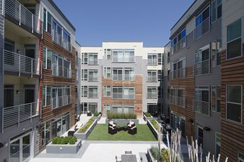 Building exterior and courtyard with grills at 2255 Wisconsin, Washington, 20007